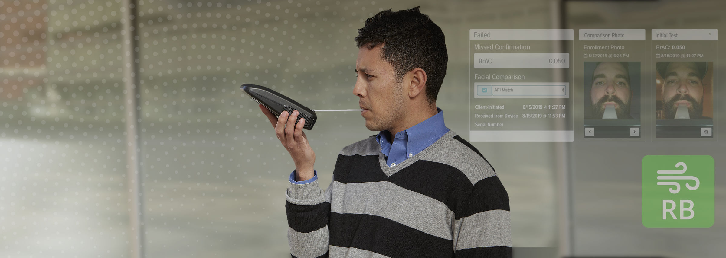 A young man using a portable breath alcohol testing device.