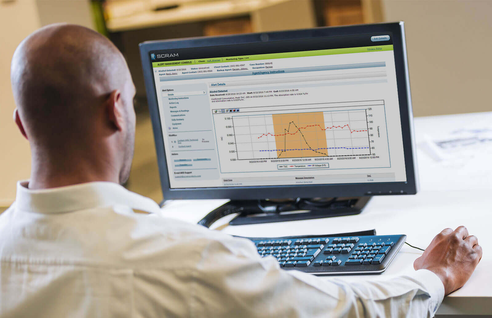 A SCRAM analylist reviewing an alcohol detection alert from a SCRAM CAM bracelet.